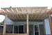 Medium size, low, single level deck design with planters and a pergola.