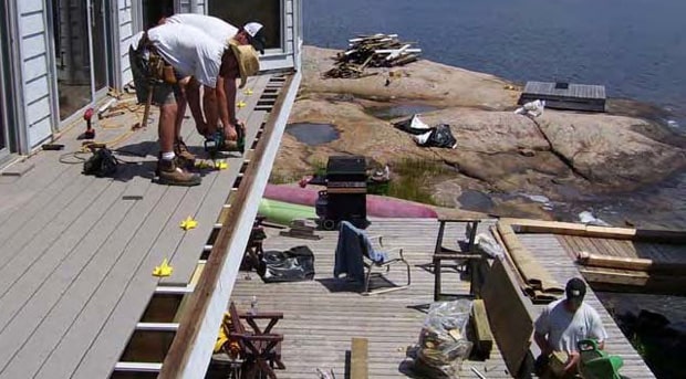Second story deck, under construction, ready to have aluminum railing installed.