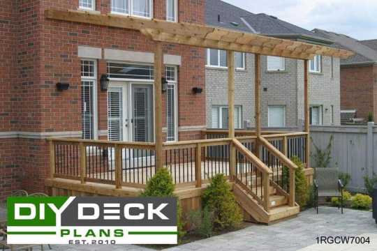 Medium size deck with a pergola attached to a red brick house.
