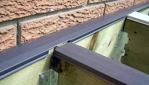 Deck sub-structure showing joist cap on single and double joists where joists are attached to header.