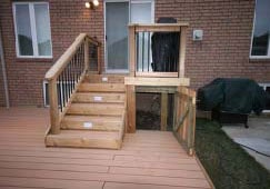 An open gate showing storage area underneath deck, hidden by deck skirt.